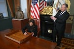 Vice President Harris signs the drawer of her desk as second gentleman Doug Emhoff takes a picture on Jan. 16, 2025.