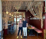 Liz Davis, the founder and owner of Xico restaurant, stands with sous chef Jamil Aguilar. Throughout the pandemic, the pair cut, fried and packaged their tortilla chips by hand to sell to local stores.