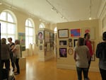 Judge Nicole Pietrantoni talks with gallery visitors and artists at Pendleton Center for the Arts Open Regional Show.