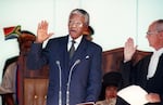 Nelson Mandela takes the oath during his presidential inauguration on May 10, 1994, in Pretoria. He is South Africa's first Black president.