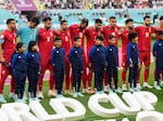 The team of Iran standing on the pitch waiting for the national anthem prior to the the match against England on Nov. 21. The team stayed silent during the anthem in apparent solidarity with protesters.