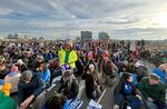 Supporters of the Portland Association of Teachers sit on the Burnside Bridge Tuesday morning, as part of an organized march from the PAT offices in Northeast Portland to the downtown waterfront, Nov. 21, 2023.