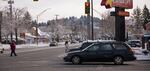 Commuters cross Powell Boulevard early in the morning on Feb. 21, 2018.