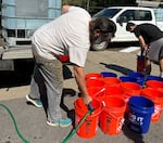 Jerry Cahill has been flushing toilets as a volunteer since his studio in Asheville's River Arts District was destroyed by flooding from the remnants of Helene.