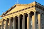 FILE - The Treasury Department is seen near sunset in Washington, Jan. 18, 2023. The national debt is at the core of a dispute about how to raise the government's legal borrowing authority, which could come to a head this summer if the government runs out of accounting maneuvers to keep paying its bills.