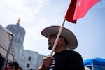 Raul Rodriguez Hernandez with Piñeros y Campesinos Unidos del Noroeste, the Oregon's Farmworker Union, listens to speakers during the Day Without an Immigrant demonstration in protest of U.S. immigration policy and advocating workers’ rights in front of Oregon State Capitol Salem, Ore., on May 1, 2026, International Workers’ Day.