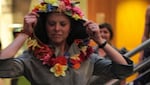 A model displays a tunic made in part of repurposed plastic flowers.
