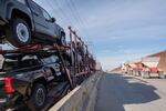 A car carrier trailer drive to cross to the U.S. at Otay Commercial port in Tijuana, Mexico on January 31. President Donald Trump's threatened tariffs on Mexico and Canada, set to go into effect on Tuesday, would hurt the Mexican economy — but also hurt auto plants in the U.S.