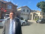 Hugo Salas stands in front of his home in Pittsburg, Calif. On his roof are solar panels that he got through a program for low-income homes. His energy bills are now significantly lower. Now the US is expanding programs like this across the country.