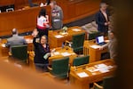 Oregon State Rep. Tawna Sanchez, D-43rd District, Shoshone-Bannock, Ute and Carrizo and NAYA’s director of family services, and Rep. Annessa Hartman​ D-40th District, Haudenosaunee, the only two Native American women to currently serve in Oregon, wave up at the row of familiar faces.