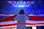 A member of the League of Women Voters of Greater Cleveland helps hold the flag during the national anthem before a basketball game on Oct. 26, 2026 in Cleveland, Ohio.