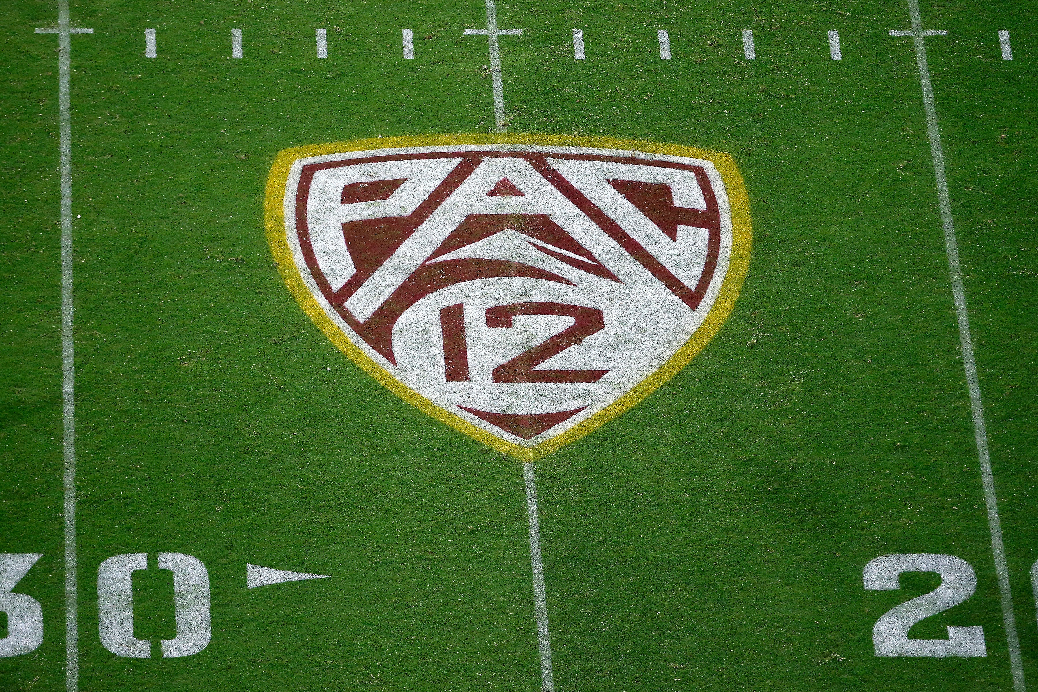 FILE - The field at Sun Devil Stadium bears a Pac-12 logo during an NCAA college football game between Arizona State and Kent State in Tempe, Ariz., Aug. 29, 2019.