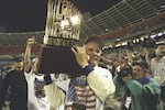 Turner hoisted the Commissioner's Trophy after his Atlanta Braves won the 1995 World Series against the Cleveland Indians.