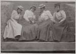 Four African American women seated on steps of building at Atlanta University, Georgia in the 1890s. Photo by Thomas E. Askew