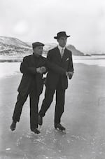 Frank Matsura, left, and Mr. Herrmann in an arms-linked ice-skating pose on the frozen Okanogan River circa 1911.