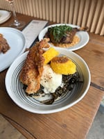 A dish of fried chicken skin, braised collards, burrata and cornbread from BIRDFAT, a pop-up modeled after the salons of the Harlem Renaissance and inspired by the music of Charlie “Bird” Parker, the menu revolves around "all things bird."