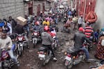 People rush to shop in downtown Goma, Congo, on Thursday, after the M23 rebels advanced into eastern Congo's capital Goma.