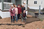 Louise Parker, Vanessa Henson, homeowner Christy Sloan, park owner Mike Skinner, and Vicky Francesco stand behind Sloan's new pollinator garden.