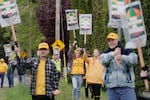 A group of workers and their supporters picket at a cannabis grow operation in Gresham, Ore., on Monday, May 2, 2022, saying their efforts to form a union are being blocked by the company. Workers and officials with the United Food and Commercial Workers Local 555 said the company CBN Holdings has been interfering with organizing efforts involving about 20 employees who work in multiple facets of the operation.