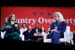 Vice President Harris speaks with former GOP Rep. Liz Cheney at a campaign event in Brookfield, Wis., on Oct. 21, 2024.