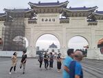 Taipei residents walk past the Liberty Square Arch in the city's downtown Zhongzheng district.