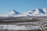 Disaster Peak, left, punctuates the northwest rim of the McDermitt Caldera in southeast Oregon, Jan. 14, 2022. The historic lakebed in the foreground contains some of the highest concentrations of lithium in the United States.