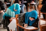 In December, the Taliban banned female students from attending university. Some of them are turning to online options. Above: Afghan female students attend Kabul University in 2010.
