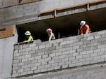Construction workers on a job site in Miami on March 10, 2023. Although, industries such as construction are particularly sensitive to rising interest rates, builders added 15,000 jobs in April.