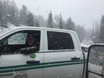 "Fire Behavior analyst Tobin Kelley doesn't have active fire behavior to observe today, as it is snowing this afternoon on the 1640 Road near Roads End," writes the Canyon Creek Complex information on its Facebook page.
