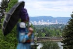 Efemmera Gendera looks out over downtown Portland during the event. 