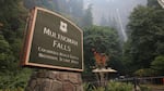 The Multnomah Falls sign on Sept. 6, 2017 as the Eagle Creek Fire looms nearby.