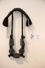 Garland of glass, leather, and horsehair created by artist Emily Nachison. Her artwork seeks alternate realities through the use of meaningful materials, such as glass that symbolizes preservation and fragility, and hair or leather that symbolize the body.