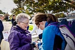 Halli Stone (left) of Parents Against Bad Books persuades Samantha Neis to sign a petition protesting what the group considers obscene books at the Idaho Falls Public Library.