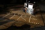 FILE - Candles spell out the name of Tyre Nichols during a candlelight vigil for Nichols on the anniversary of his death, Jan. 7, 2024, in Memphis.