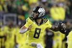 Oregon Ducks quarterback Dillon Gabriel (8) passes against Michigan State during the second half of an NCAA college football game, Friday, Oct. 4, 2024, in Eugene, Ore. 