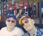 Brian David Johnson with his dad at a baseball game in 2016.