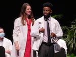 People of color who have a doctor who looks like them report more satisfaction with their health care. Here, Abel Woldu and Dr. Kelsey Angell participate in the University of Minnesota's white coat ceremony in 2022. Half of that incoming class of doctors-in-training are people of color.