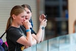 Victoria Krughkov cries as she looks over the ice rink after the final skate and closure of the ice rink. With the closure of the ice rink, there are no more permanent ice skating rinks in Portland.