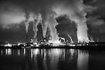 Smoke stacks during a night scene in Tacoma, Wash. The governors of California, Washington and Oregon and the premier of British Columbia announced on Oct. 28, 2013 their plan to align strategies to curb greenhouse gas emissions.