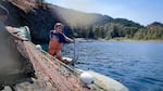 Aiyana George, the youngest member of the family’s fishing crew, fishing in 2021. One of her jobs is to call out "Fish!" when she sees a salmon in the net.