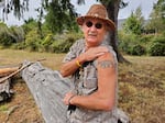 Siuslaw tribal member Doug Barrett, a.k.a. Running Bear, shows off his bear tattoo.