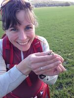 Danielle Nelson, a doctoral student at Oregon State University holds a Pacific chorus frog.