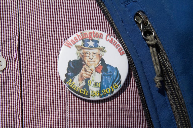 A man displays his Bernie Sanders button at Washington state's Democratic caucus on March 26, 2016. The Vermont senator won the state by a large margin.