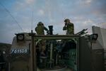 Israeli soldiers prepare and fire mortars from inside Israel, into Gaza, backing up troops near the Maghazi refugee camp, where three large-scale incidents happened in which nearly two dozen Israeli soldiers were killed on Jan. 22.