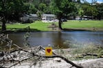 A painted broken heart is seen near Camp Mystic along the Guadalupe River in Hunt, Texas, on July 8, 2025, after severe flash flooding over the July 4 holiday weekend. 