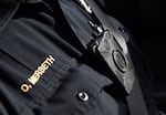 In this Feb. 2, 2015, file photo, Duluth police officer Dan Merseth patrols wearing his body camera in Duluth, Minn.