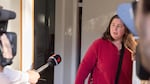 Erin Patterson talks to reporters outside of her home in 2023.
