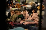 Children, fleeing from Ukraine,play in a shelter designed for women and children at the train station in Przemysl, Poland, Thursday, March 3, 2022. The U.N. refugee agency said Thursday at least 1 million people have fled Ukraine since Russia’s invasion a week ago, an exodus without precedent in this century for its speed.