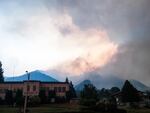 The Eagle Creek Fire is seen burning behind the Cascade Locks City Hall Monday, Sept. 4, 2017. 