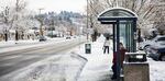 Commuters wait for the bus on Portland's Powell Boulevard, Feb. 21, 2018.